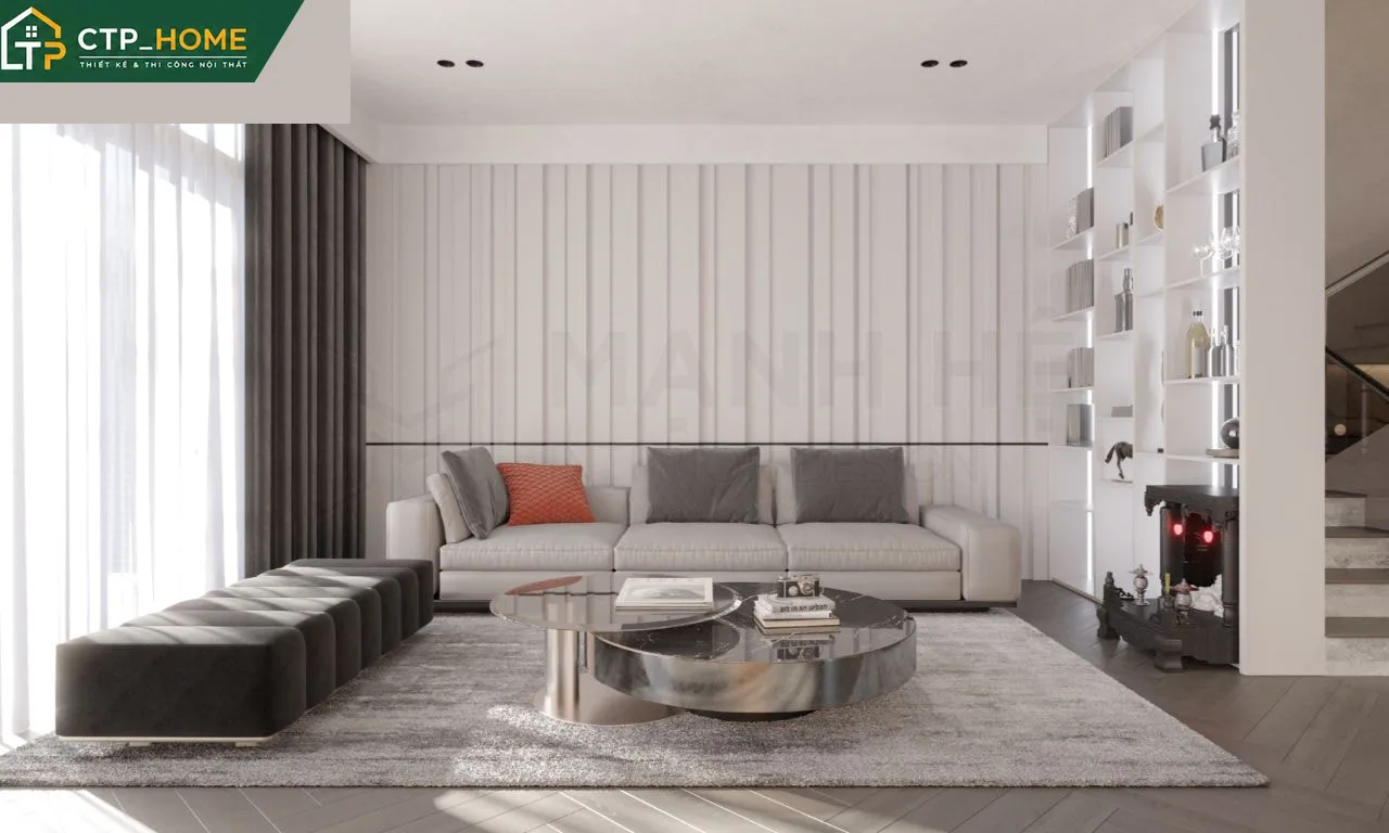 Phòng khách nhà phố Tiền Giang với sofa da cao cấp và kệ tivi gỗ óc chó tự nhiên