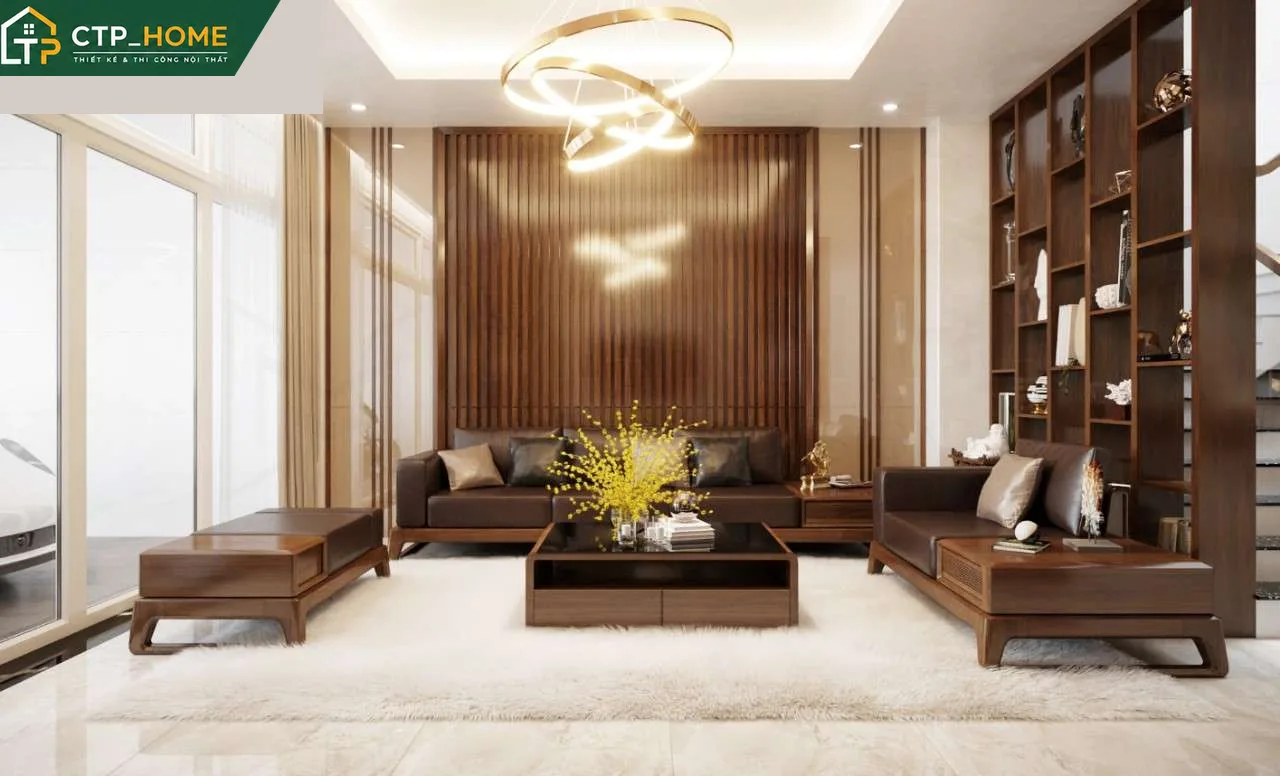 Thiết kế nội thất phòng khách nhà phố Tiền Giang hiện đại với sofa da cao cấp và kệ tivi gỗ óc chó