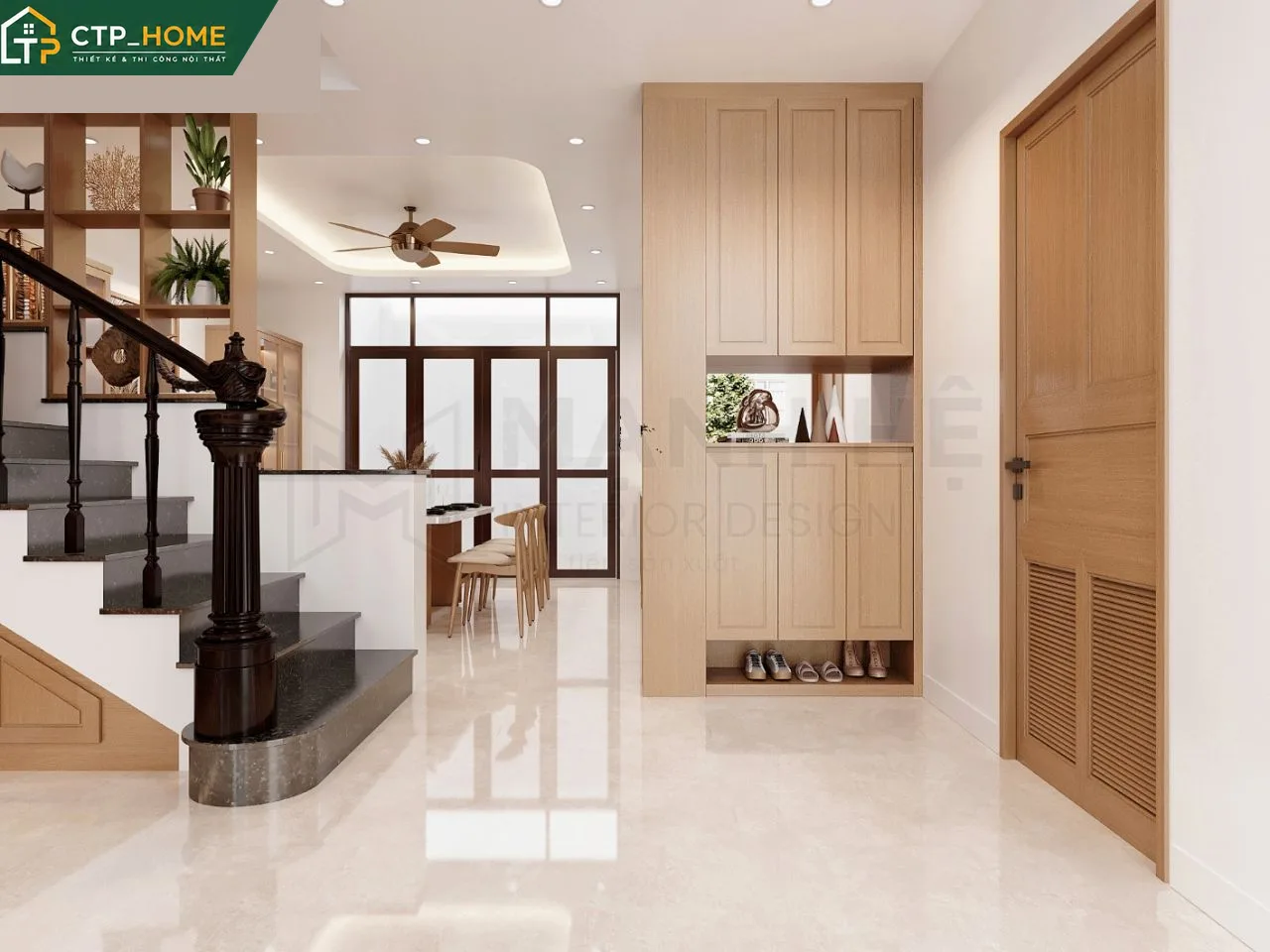 Bếp mở hiện đại nhà phố Vũng Tàu với tủ bếp gỗ óc chó và mặt đá marble trắng