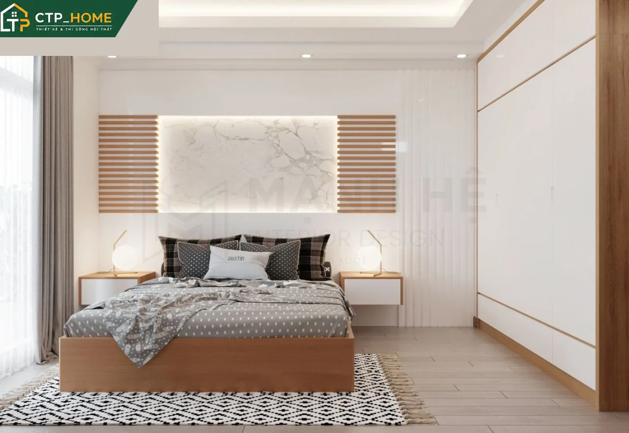 Phòng ngủ master nhà phố Vũng Tàu với giường gỗ óc chó và hệ thống đèn giấu kín hiện đại