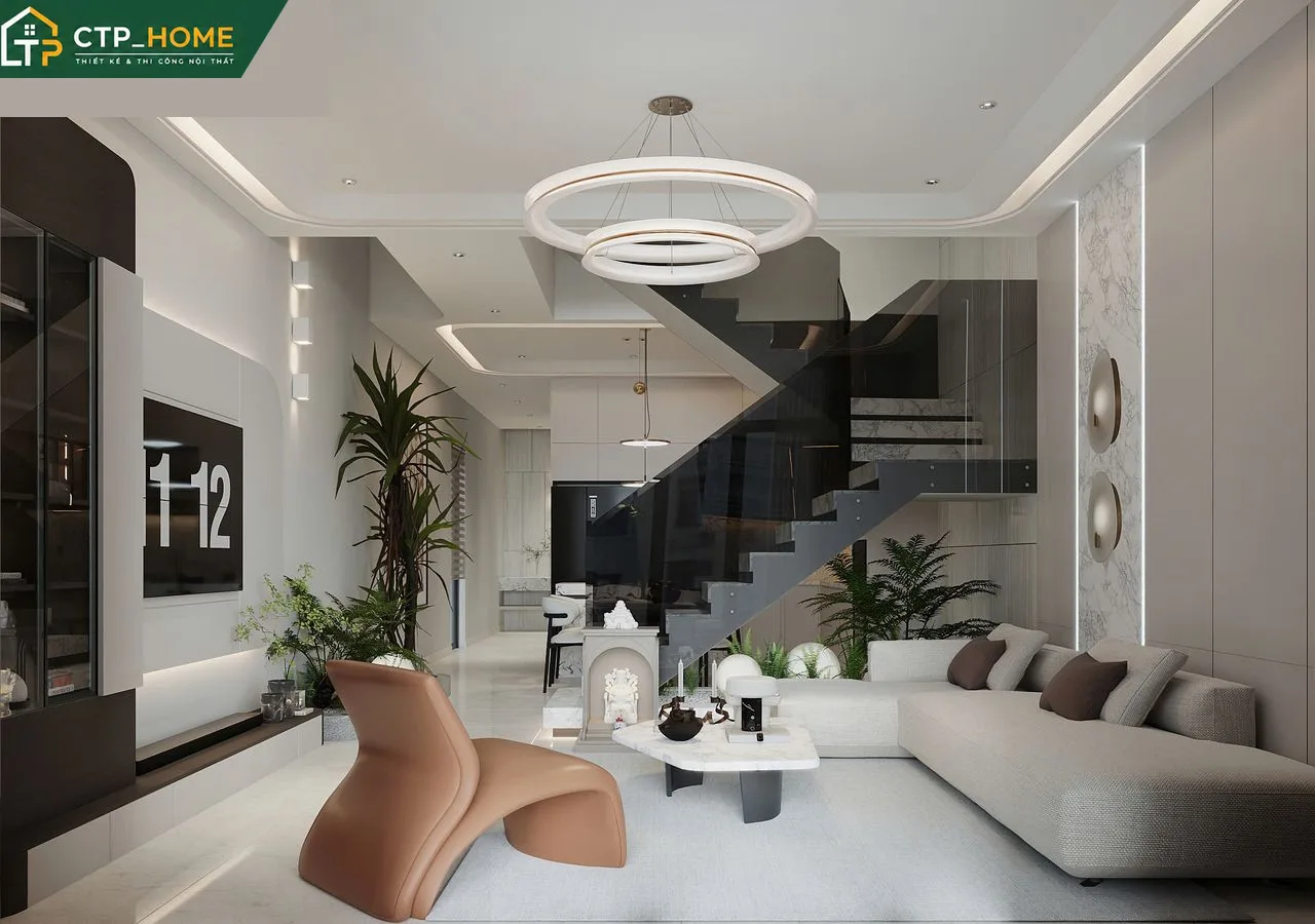 Phòng khách nhà phố Bình Dương hiện đại với sofa da cao cấp và kệ tivi gỗ óc chó