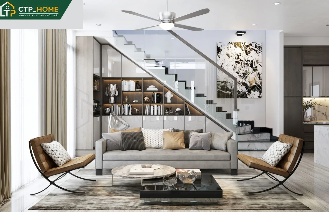 Phòng khách nhà phố Quận 3 thiết kế hiện đại với tone xám – be chủ đạo, sofa da cao cấp và kệ tivi gỗ óc chó