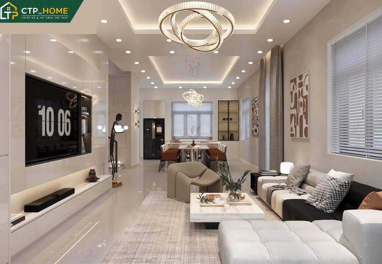 Phòng khách nhà phố Đồng Nai 2 tầng với sofa da cao cấp và kệ tivi gỗ óc chó tự nhiên