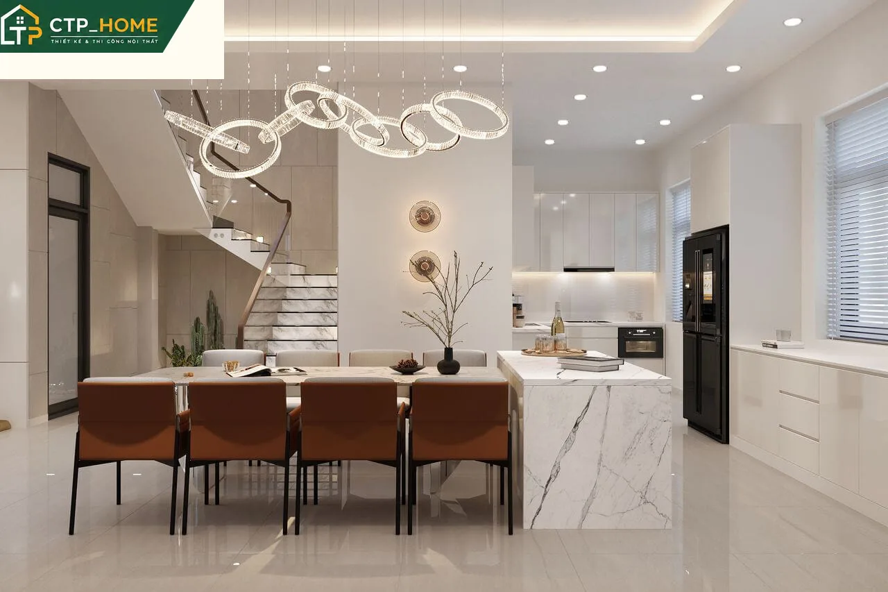 Phòng bếp – ăn liền kề hiện đại với tủ bếp gỗ óc chó và mặt đá nhân tạo cao cấp